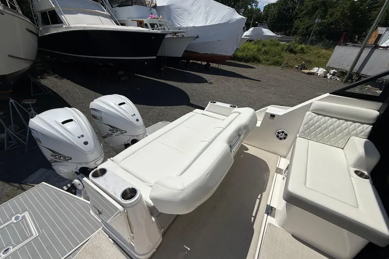Slide: The Image of 2022 Regal 36 XO boat with twin Yamaha V8 engines and luxurious seating. - 21