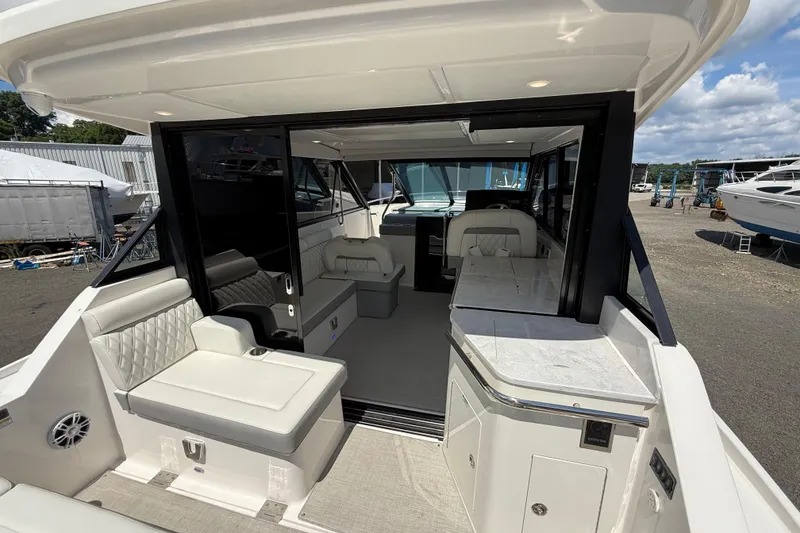 Slide: The Image of 2022 Regal 36 XO yacht interior with luxurious seating and modern design. - 23