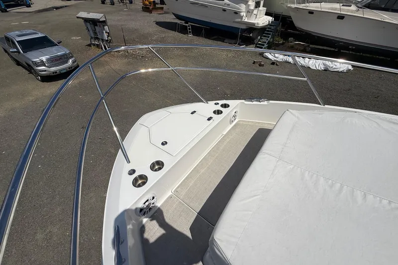 Slide: The Image of 2022 Regal 36 XO boat deck with seating and cup holders. - 44