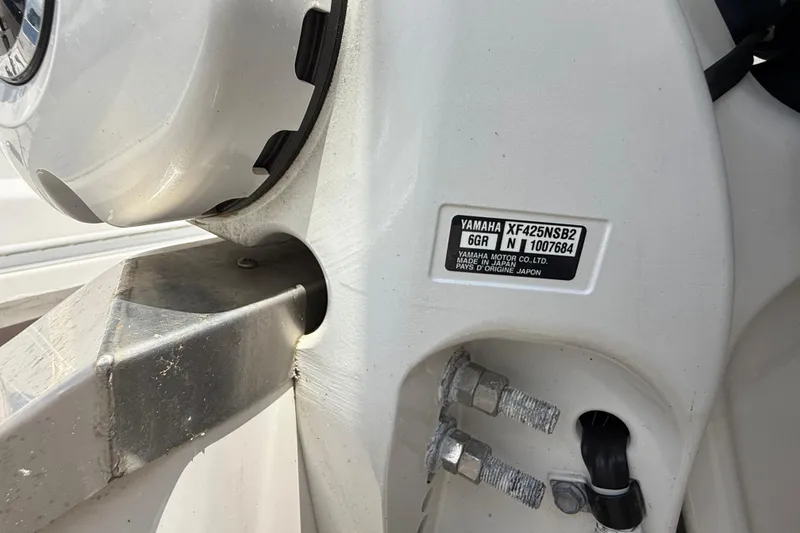 Slide: The Image of Close-up of a 2022 Regal 36 XO boat's Yamaha motor label and mounting details. - 64