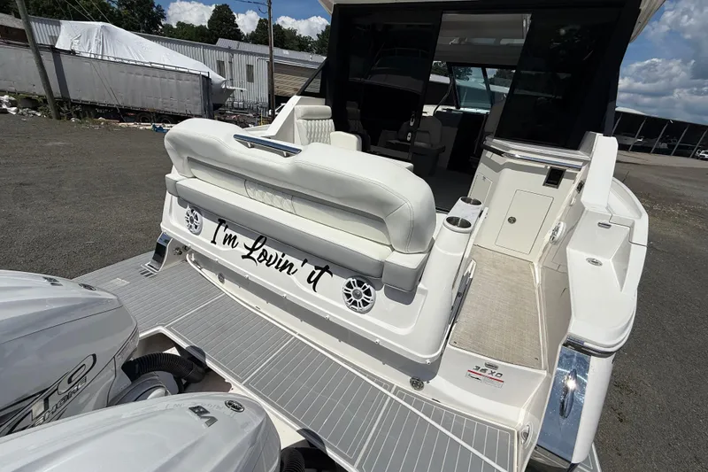 Slide: The Image of 2022 Regal 36 XO boat with "I'm Lovin' It" text on the back. - 9