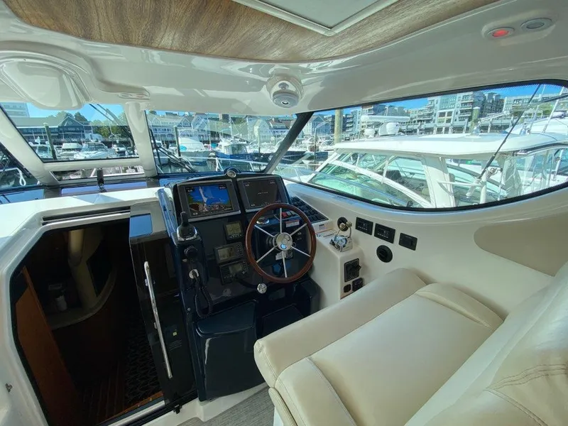 Slide: The Image of Interior of 2009 Tiara Yachts 4300 Sovran, helm with modern electronics. - 2