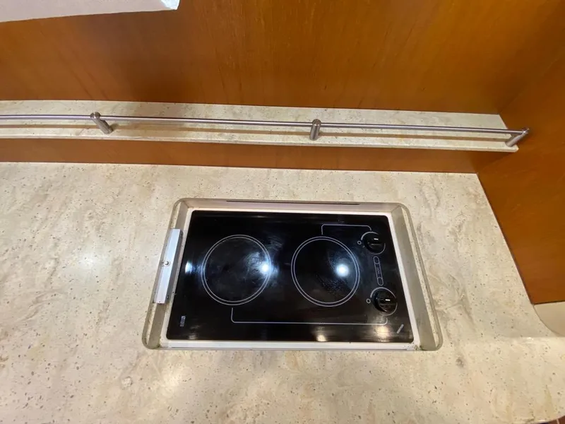 Slide: The Image of Galley with cooktop on Tiara Yachts 4300 Sovran, year 2009. - 23