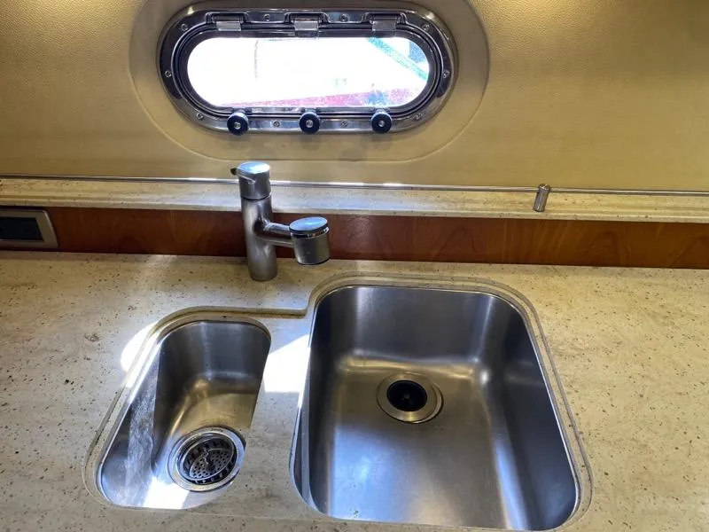 Slide: The Image of Tiara Yachts 4300 Sovran 2009 kitchen area with stainless steel sink. - 24