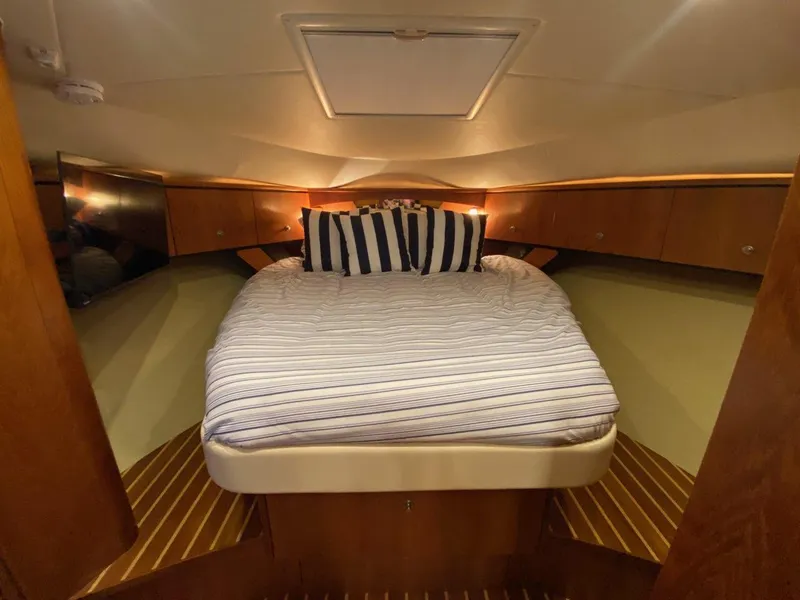 Slide: The Image of Interior of 2009 Tiara Yachts 4300 Sovran with cozy bed. - 25