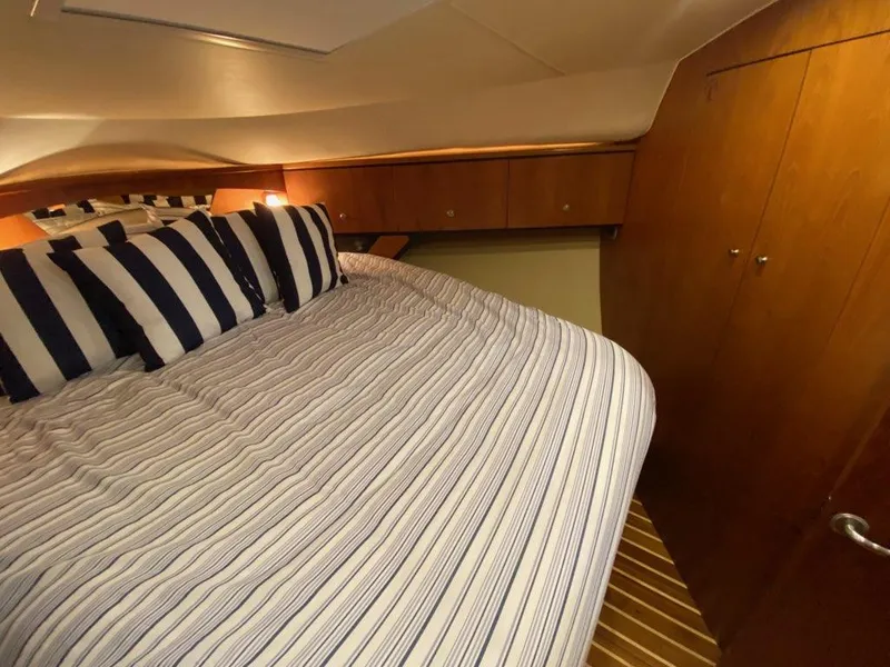 Slide: The Image of Interior of 2009 Tiara Yachts 4300 Sovran with cozy bed. - 27