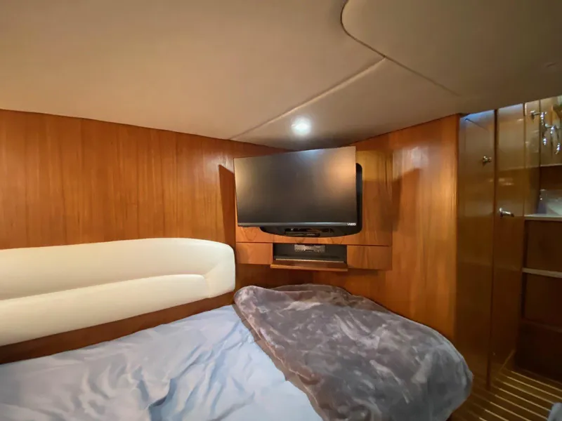 Slide: The Image of Interior of 2009 Tiara Yachts 4300 Sovran with TV and bed. - 31