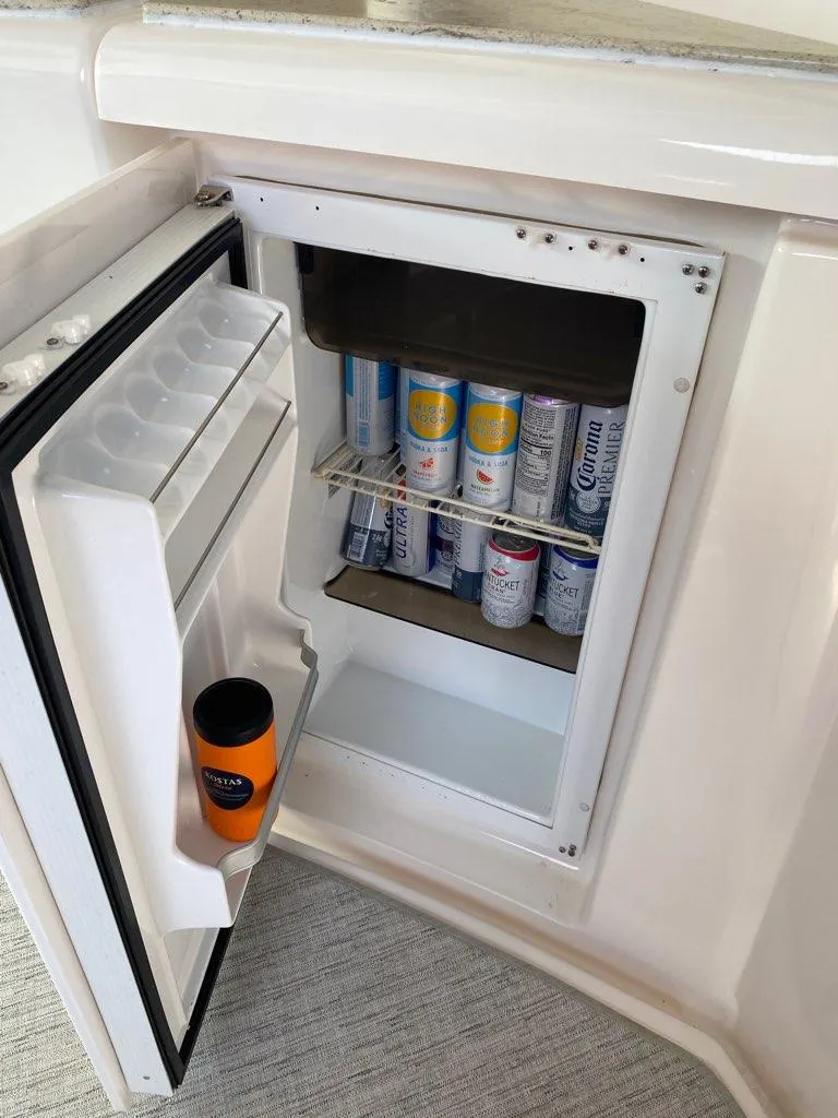 Slide: The Image of Mini fridge stocked with drinks on 2009 Tiara Yachts 4300 Sovran. - 35