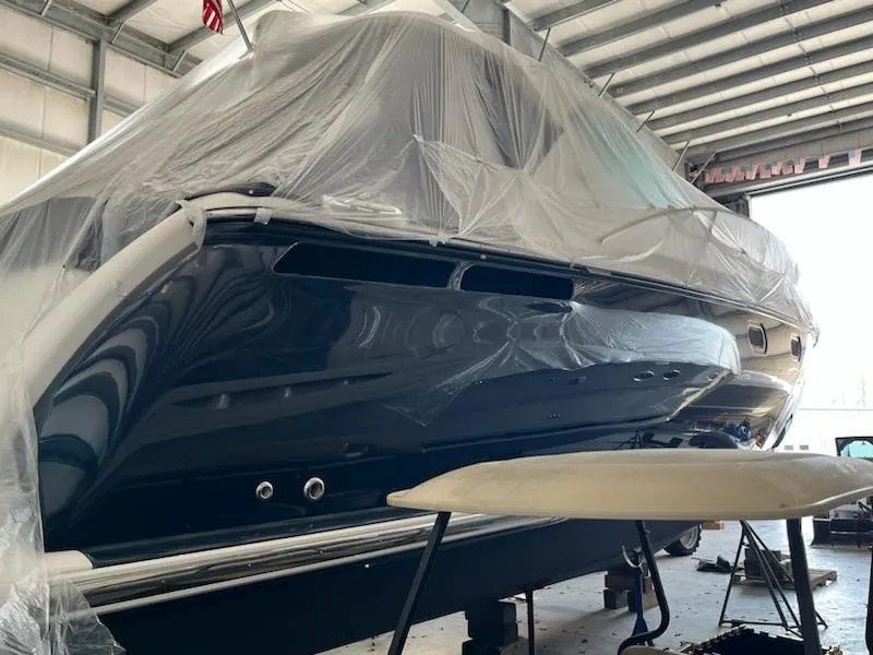 Slide: The Image of 2009 Tiara Yachts 4300 Sovran in a workshop, partially covered. - 37