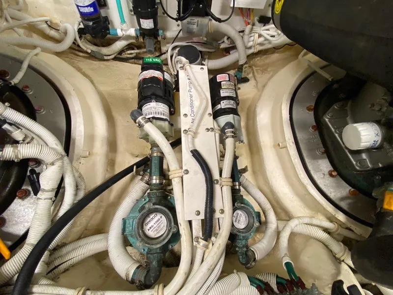 Slide: The Image of Engine room of 2009 Tiara Yachts 4300 Sovran with pumps and hoses. - 44