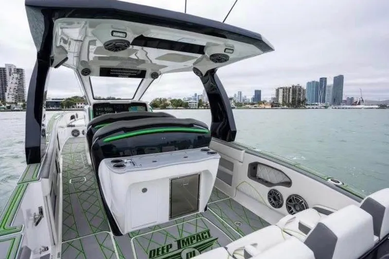 Slide: The Image of 2024 Deep Impact 399 Sport boat interior with modern design and city skyline backdrop. - 4