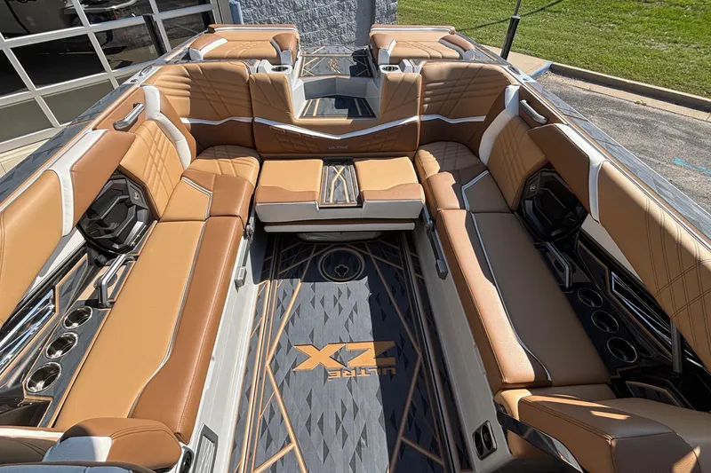 Slide: The Image of Luxurious interior of 2025 Tigé Ultré 25ZX boat with tan leather seating. - 16