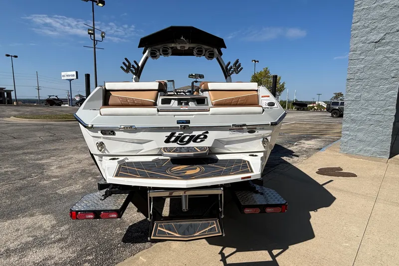 Slide: The Image of 2025 Tigé Ultré 25ZX boat rear view, showcasing sleek design and luxurious seating. - 5