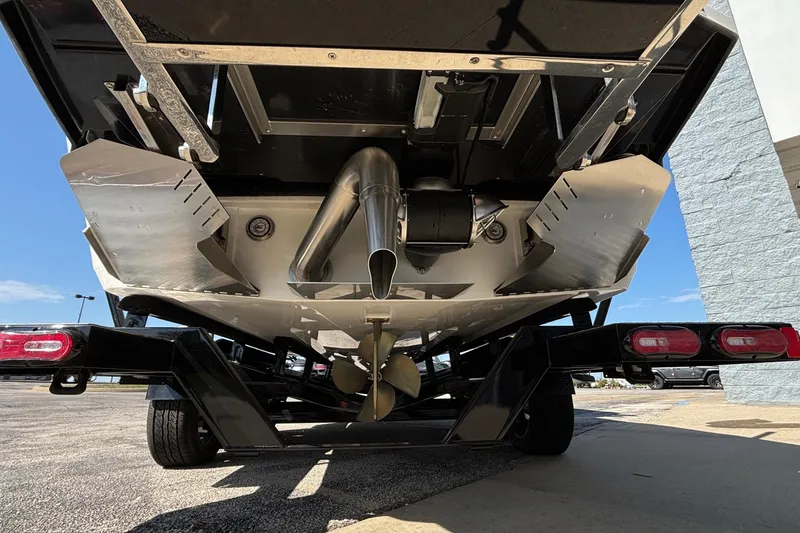 Slide: The Image of 2025 Tigé Ultré 25ZX boat underside with propeller and exhaust system. - 7