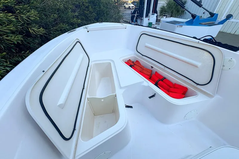 Slide: The Image of 2001 Grady-White Chase 263 boat storage compartments with life jackets. - 17