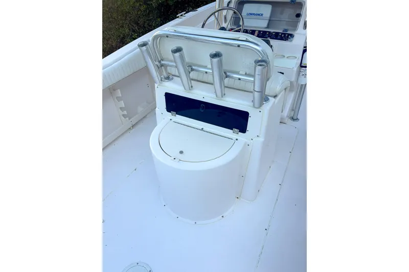 Slide: The Image of 2001 Grady-White Chase 263 boat interior with rod holders and steering console. - 7