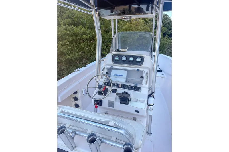 Slide: The Image of 2001 Grady-White Chase 263 boat console with steering wheel and navigation equipment. - 9