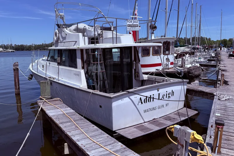 The Image of 1978 Mainship 34 Trawler docked at marina, labeled "Addi Leigh," Watkins Glen, NY. - 0