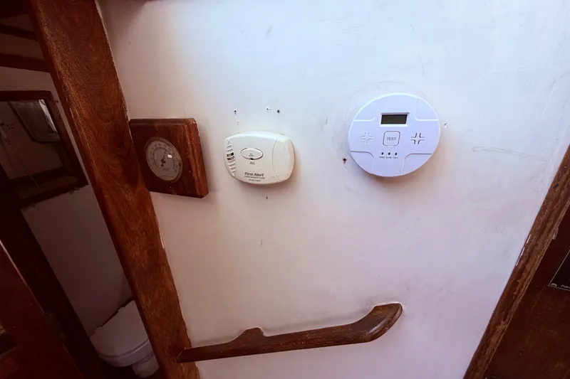 Slide: The Image of Interior of 1978 Mainship 34 Trawler with thermostat and carbon monoxide detector on wall. - 33
