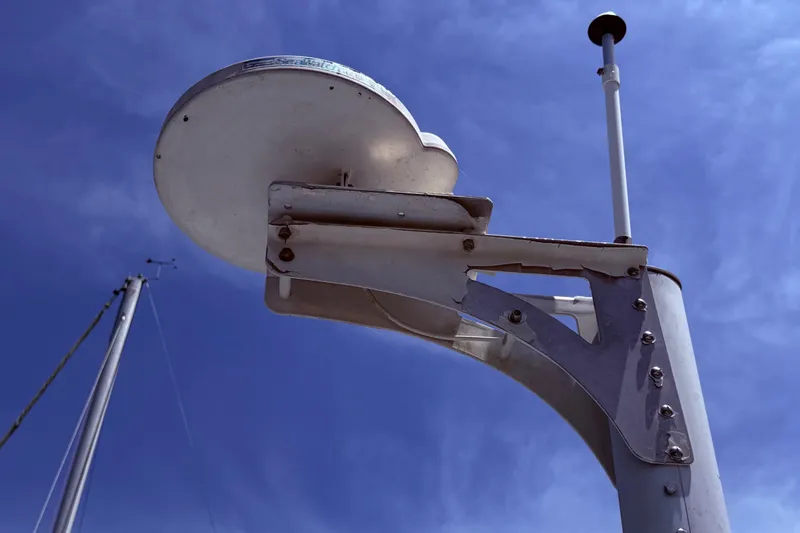 Slide: The Image of Radar equipment on a 1978 Mainship 34 Trawler against a clear blue sky. - 9