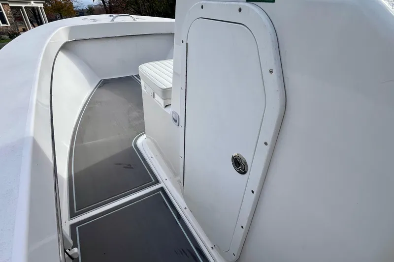 Slide: The Image of 2023 Jones Brothers 23 Cape Fisherman Lite Tackle boat interior with storage compartment. - 15