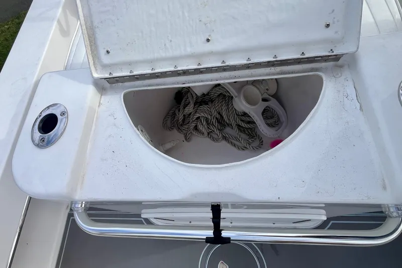 Slide: The Image of Open storage compartment on 2023 Jones Brothers 23 Cape Fisherman Lite Tackle boat. - 29