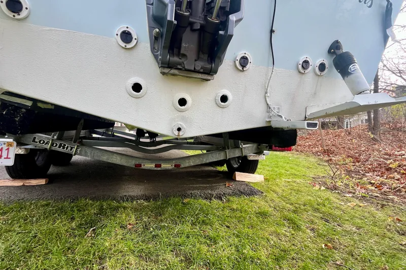 Slide: The Image of 2023 Jones Brothers 23 Cape Fisherman Lite Tackle boat on trailer, rear view. - 31