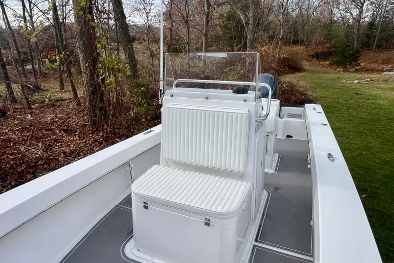 Slide: The Image of 2023 Jones Brothers 23 Cape Fisherman Lite Tackle boat in wooded setting. - 5