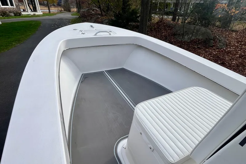 Slide: The Image of 2023 Jones Brothers 23 Cape Fisherman Lite Tackle boat interior with seating and deck view. - 6