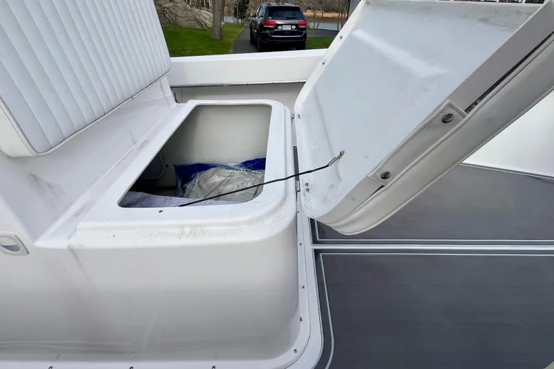 Slide: The Image of Open storage compartment on 2023 Jones Brothers 23 Cape Fisherman Lite Tackle boat. - 9