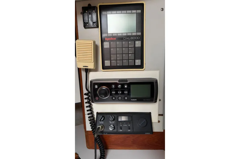 Slide: The Image of Control panel of a 1987 O'Day 322 sailboat with navigation and communication equipment. - 20