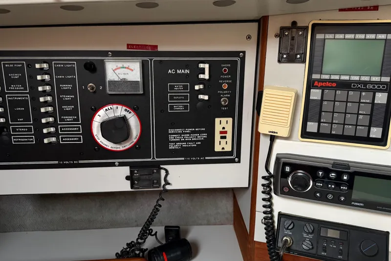 Slide: The Image of Control panel of a 1987 O'Day 322 sailboat with navigation and communication equipment. - 21