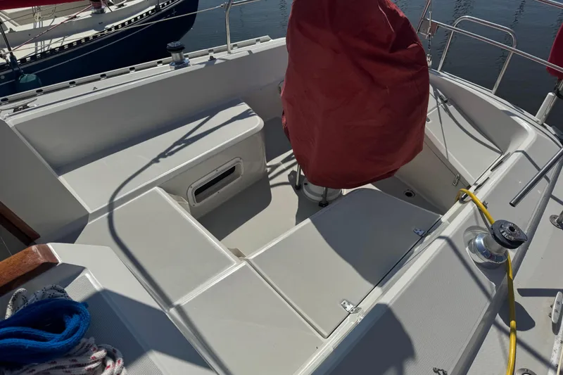 Slide: The Image of 1987 O'Day 322 sailboat cockpit with covered wheel and seating area. - 6