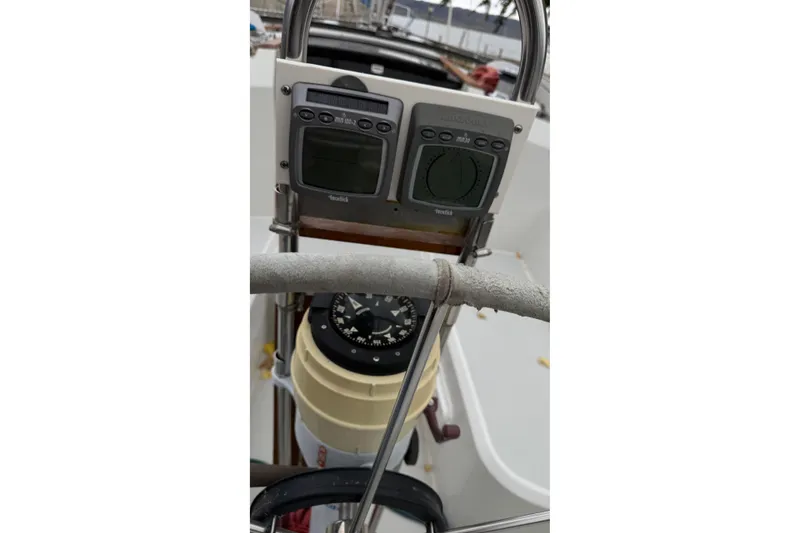 Slide: The Image of Cockpit of 1987 O'Day 322 sailboat with navigation instruments and compass. - 9