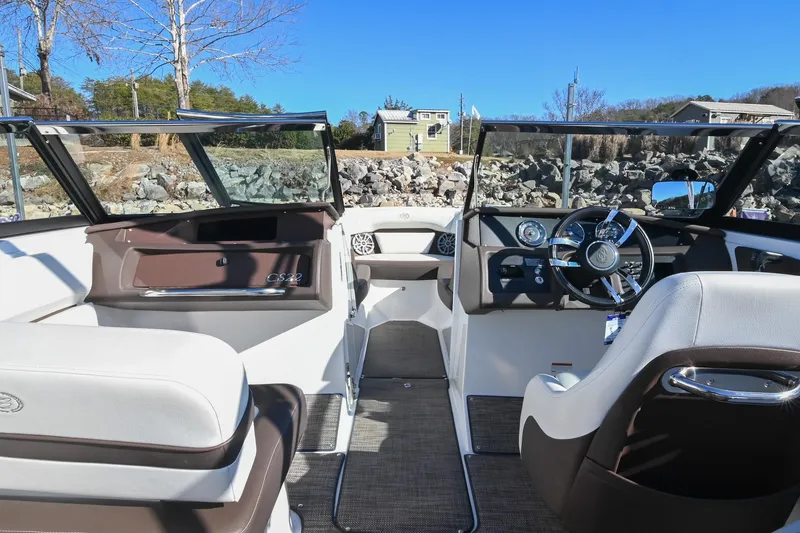 Slide: The Image of 2023 Cobalt CS22 boat interior with modern dashboard and seating, showcasing luxury design. - 20