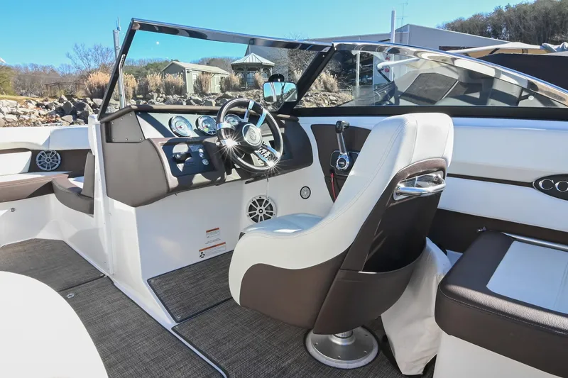 Slide: The Image of 2023 Cobalt CS22 boat interior with modern dashboard and steering wheel. - 24
