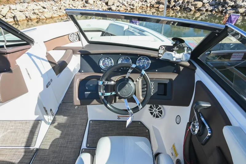 Slide: The Image of 2023 Cobalt CS22 boat interior with steering wheel and dashboard controls. - 25