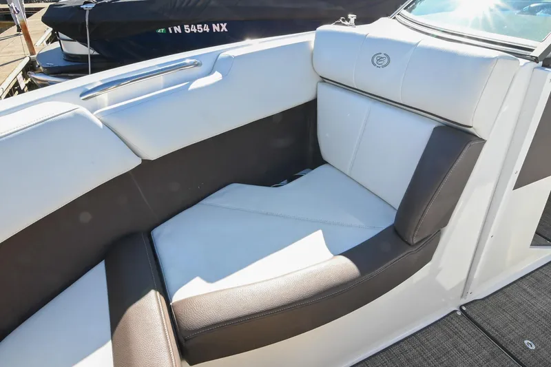 Slide: The Image of 2023 Cobalt CS22 boat interior with luxurious white and brown seating. - 36