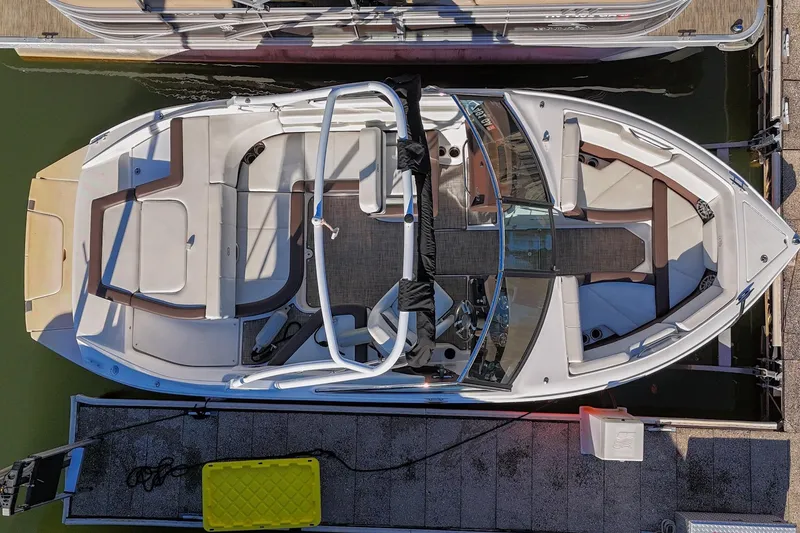 Slide: The Image of Overhead view of a 2023 Cobalt CS22 boat docked at a marina. - 6