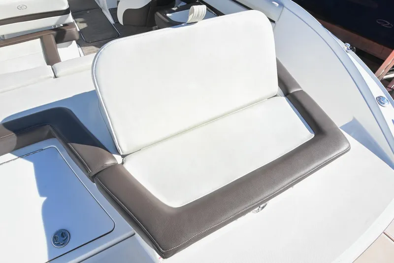 Slide: The Image of 2023 Cobalt CS22 boat seat with white and brown upholstery, showcasing luxury design. - 9