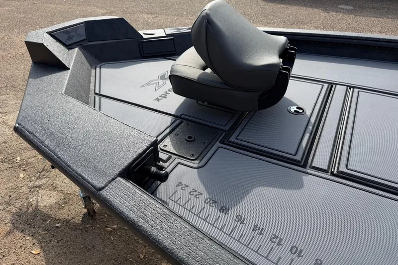 Slide: The Image of 2026 Xpress X18DB boat deck with seat and measurement markings. - 3