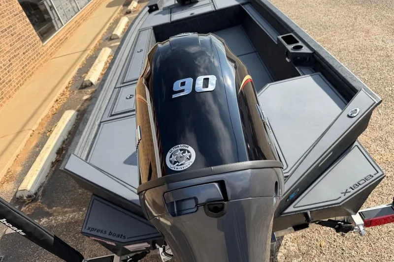 Slide: The Image of 2026 Xpress X18DB boat with 90 HP engine, featuring ultra-low emissions. - 9