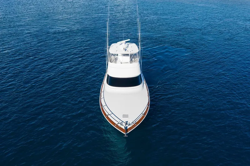 Slide: The Image of Aerial view of 2025 Viking 58 Convertible yacht on open water. - 2