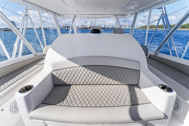 Slide: The Image of 2025 Viking 58 Convertible yacht interior with luxurious seating and ocean view. - 29