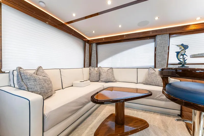 Slide: The Image of Luxurious interior of 2025 Viking 58 Convertible yacht with elegant seating and wooden accents. - 42