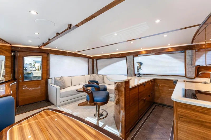 Slide: The Image of Luxurious interior of 2025 Viking 58 Convertible yacht with elegant wood finishes and modern seating. - 44