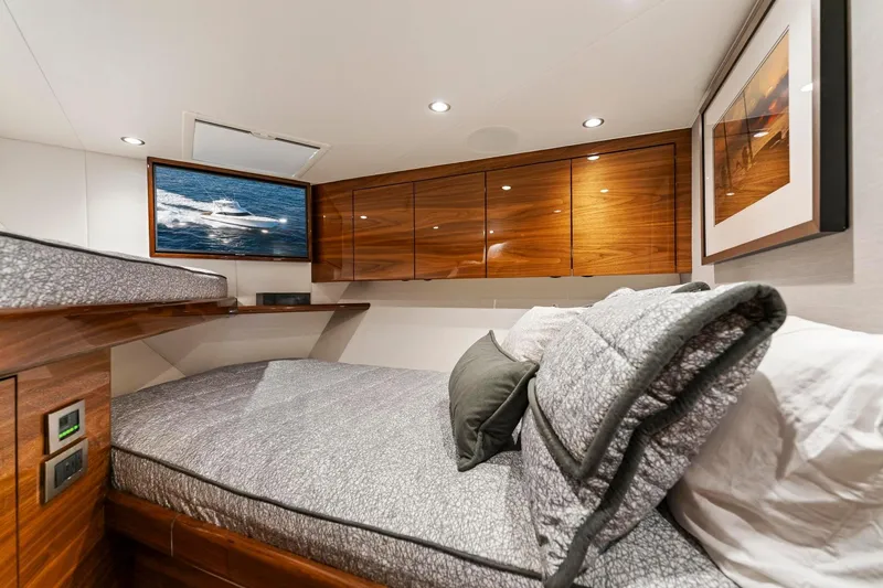 Slide: The Image of Luxurious cabin interior of 2025 Viking 58 Convertible yacht with elegant wood finishes. - 61