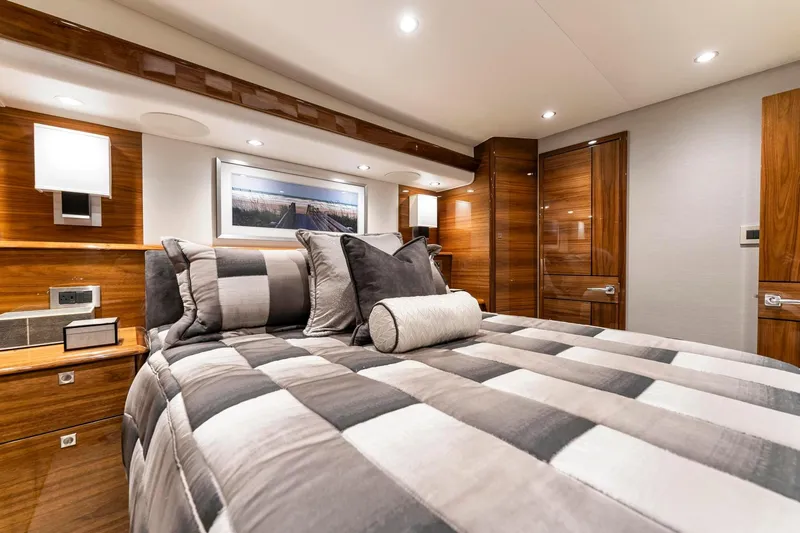 Slide: The Image of Luxurious bedroom interior of 2025 Viking 58 Convertible yacht with modern decor. - 66