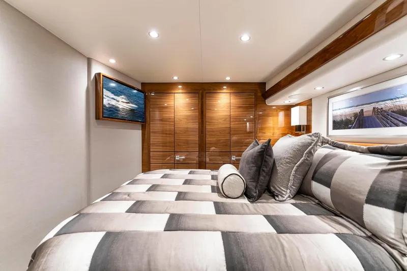 Slide: The Image of Luxurious bedroom interior of 2025 Viking 58 Convertible yacht with elegant decor and modern amenities. - 68