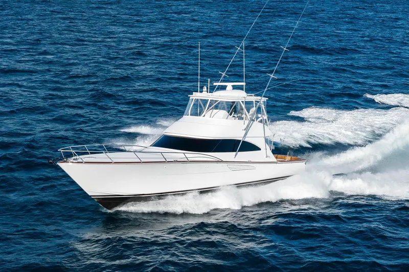 Slide: The Image of 2025 Viking 58 Convertible yacht cruising on open ocean waters. - 7